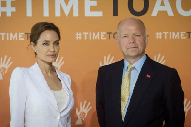 Actress Angelina Jolie and Foreign Secretary William Hague at the  'End Sexual Violence in Conflict' summit in London.