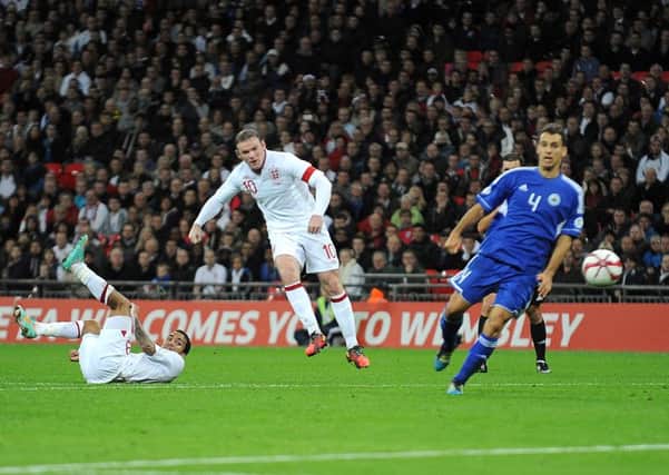England's Wayne Rooney scores against San Marino in the World Cup Qualifier. PIC: PA