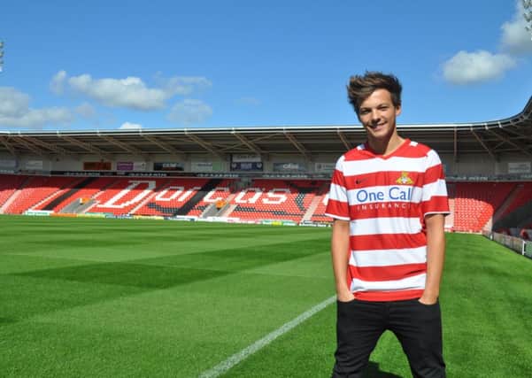 Louis Tomlinson of One Direction who is reported to be involved in a joint bid to buy his hometown football club Doncaster Rovers.