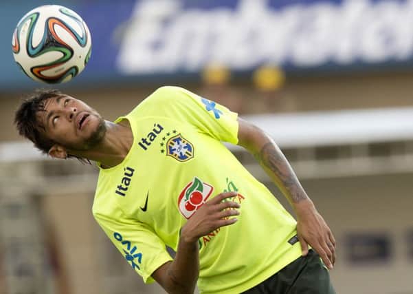 Brazil's Neymar practices during a training session at the Serra Dourada stadium in Goiania, Brazil. (AP Photo/Andre Penner)