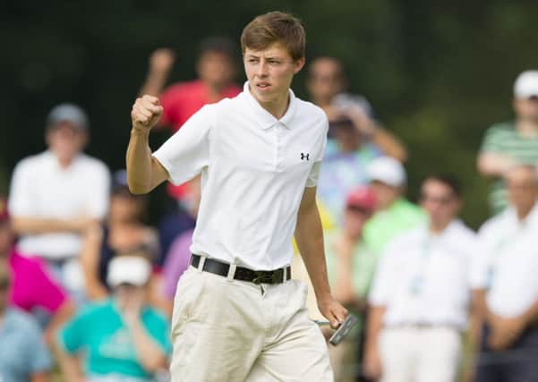 Matt Fitzpatrick pumps his fist after making a birdie on the seventh hole during the final round of match play at the 2013 U.S. Amateur at The Country Club in Brookline.  (USGA/John Mummert)