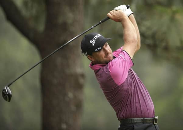 Graeme McDowell, of Northern Ireland, watches his tee shot on the second hole during the first  round of the U.S. Open golf tournament in Pinehurst.