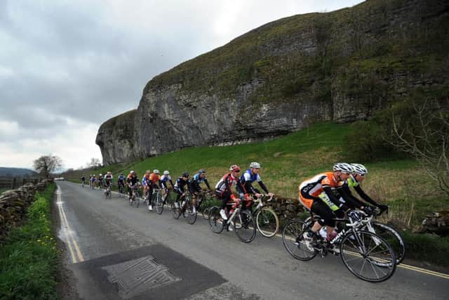 Riders pass Kilnsey Crag on the trial run. Picture by Simon Hulme
