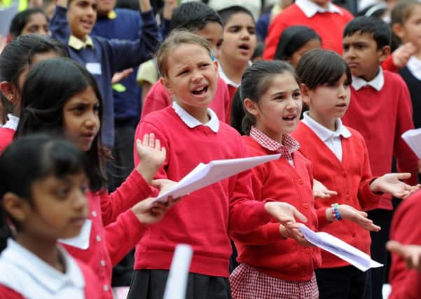 500 children opened the Bradford Festival  singing songs of peace and friendship in Centenary Square.  Picture Bruce Rollinson