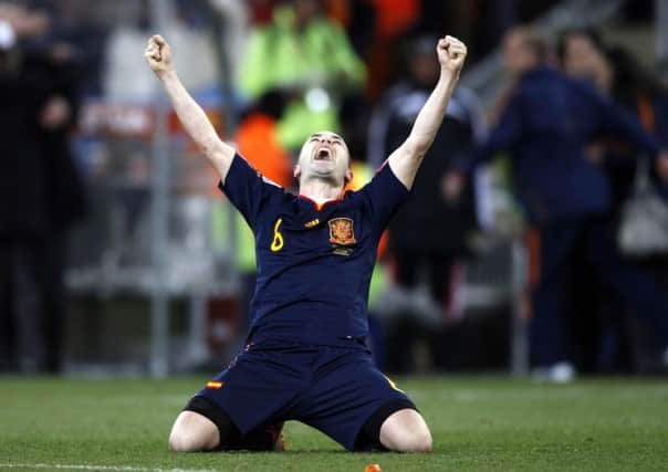 Spain's Andres Iniesta celebrates after scoring a goal during the World Cup final soccer match against the Netherlands. He gets in Robert Gledhill's team, does he make yours?  (AP Photo/Luca Bruno)