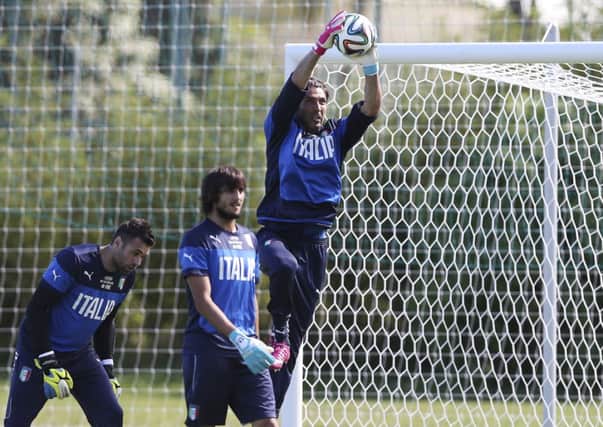 Italy's Gianluigi Buffon catches the ball during training on Friday.