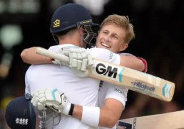 England's Joe Root is congratulated by James Anderson after scoring 200 not out against Sri Lanka at Lord's.