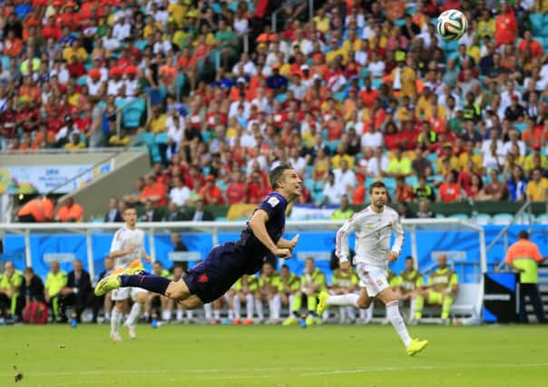Netherlands' Robin van Persie scores his first's first goal.
