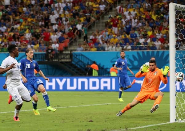 England's Daniel Sturridge scores against Italy