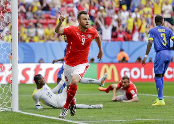 Switzerland's Haris Seferovic celebrates after scoring his side's second goal.