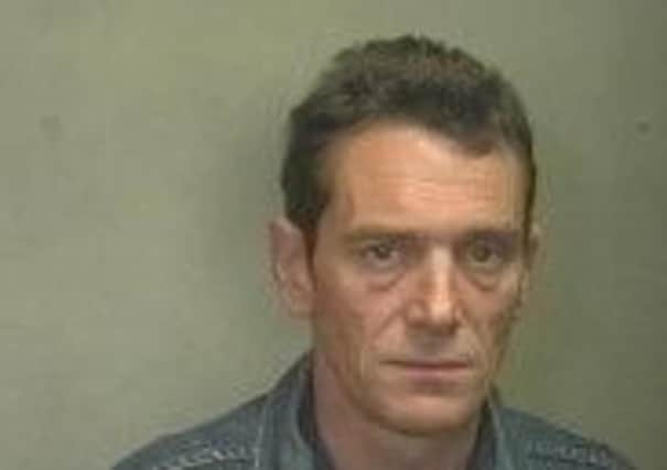Darren Cawood, wanted over robbery at William Hill in Kirkstall