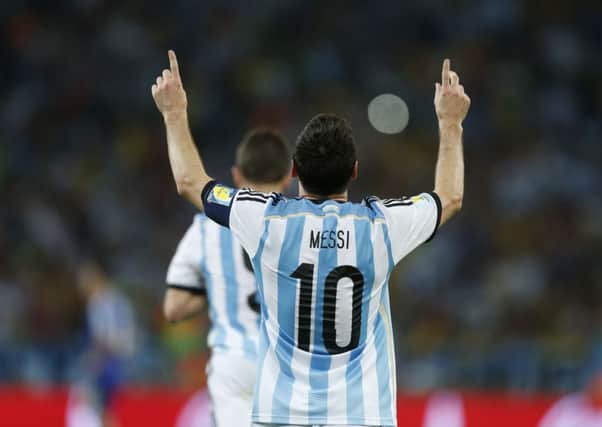 Argentina's Lionel Messi celebrates scoring his side's second goal during the group F World Cup soccer match between Argentina and Bosnia.