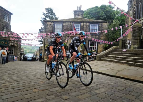 Team Sky cyclists Richie Porte and Chris Froome ride up the cobbles in Haworth on a recce for Stage 2 of the Tour de France in Yorkshire. Picture by Tony Johnson