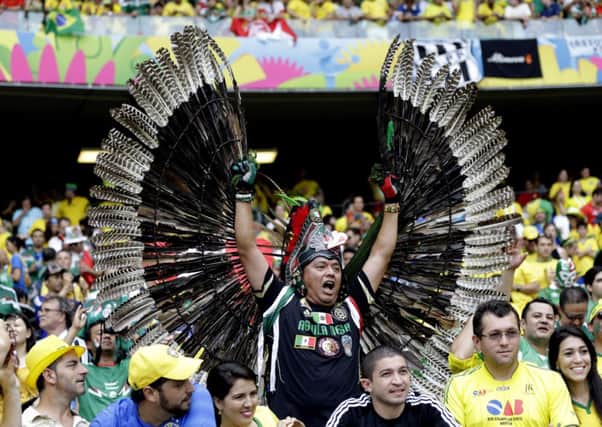 This Mexican fans exotic feathered costume provided more spectacle than a disappointing goalless draw with hosts Brazil.