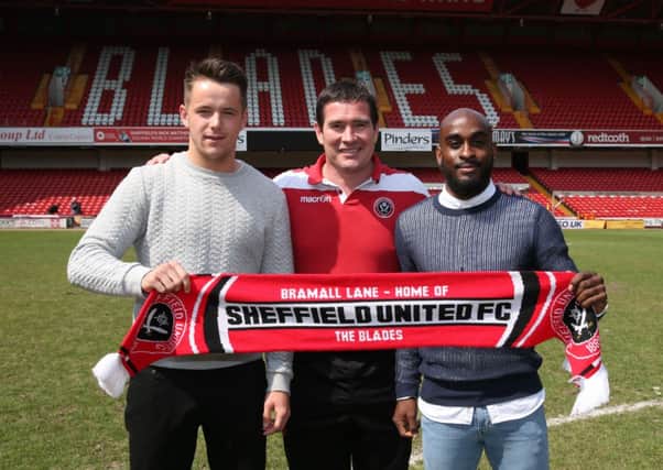 Nigel Clough with two of his summer signings Marc McNulty and Jamal Campbell Ryce.