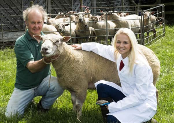 Farmer Ralph Alderson and Nicole Sandham with Ralphs Charollais ram