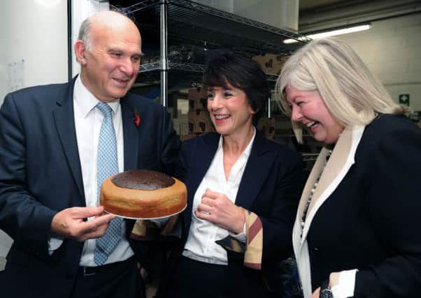 Business secretary Vince Cable chats to Viv Parry of Exquisite Homemade Cakes, centre, and Michelle Pinggera from Goldman Sachs.