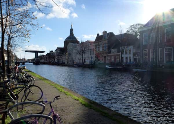 The low autumn sun shines over the canals of Leiden, Holland. Picture: Ian Day