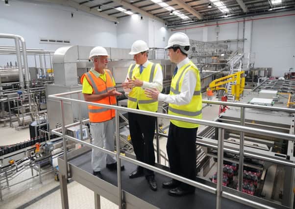 Prime Minister David Cameron and Chancellor George Osborne chat to Ian Johnson the Director of Operations at Coca Cola, during there visit to the Factory, at Wakefield. Picture by Simon Hulme