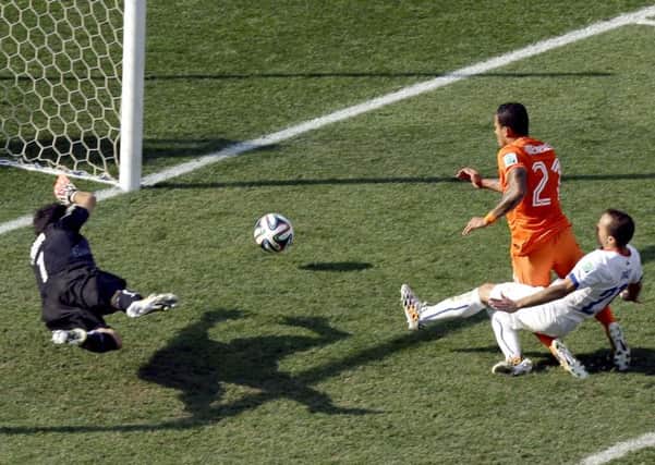 Holland's Memphis Depay scores his side's second goal against Chile.