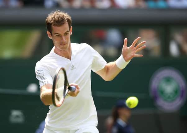 Great Britain's Andy Murray hits a winner against Belgium's David Goffin.