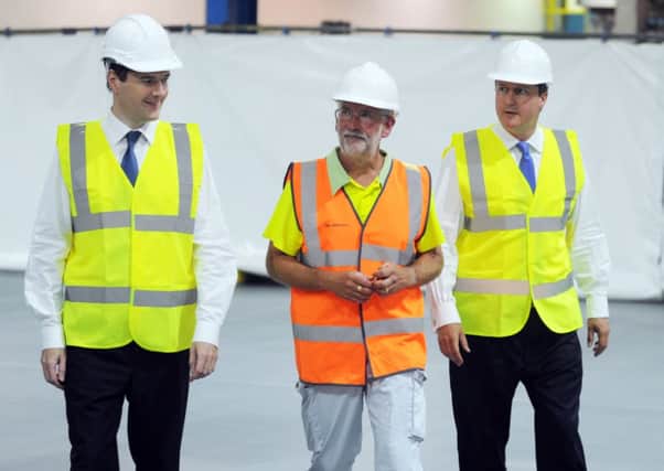Prime Minister David Cameron and Chancellor George Osborne chat to Ian Johnson the Director of Operations at Coca Cola, during there visit to the Wakefield factory. Picture by Simon Hulme