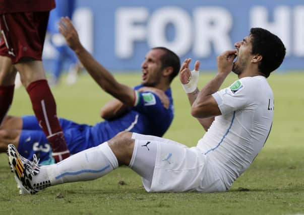 Uruguay's Luis Suarez, banned for four months.