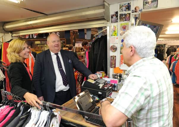 Eric Pickles MP visiting Morley, walking round Morley Market with PPC Andrea Jenkyns and trader Geoff Baig . Picture Scott Merrylees