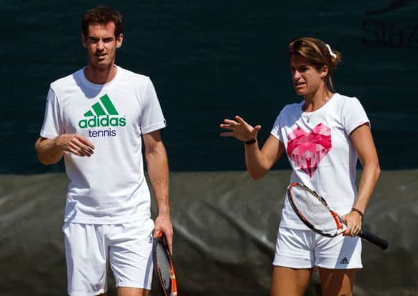 Andy Murray listens to his coach Amelie Mauresmo.