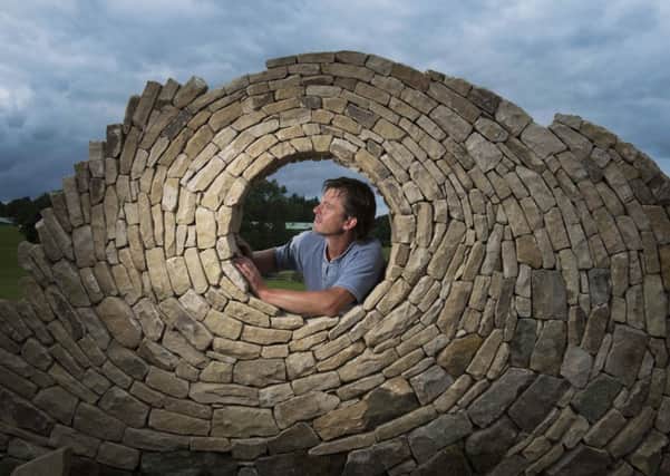 Stonemason Johnny Clasper creating a new dry stone wall sculpture inreadiness for the 2014 Great Yorkshire Show