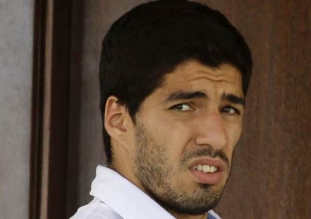 Uruguay's Luis Suarez looks out from his hotel in Natal, Brazil, on Wednesday.