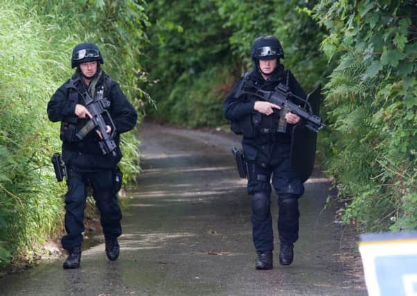 Armed police are searching for a 60-year-old man following a "domestic" incident at an address in Widegates, Cornwall