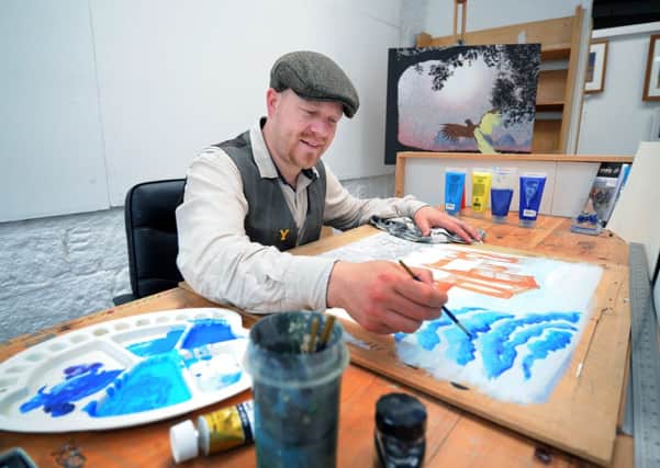 Pateley Bridge artist Alister Colley has been named the Official Artist of Grand Départ, at work in his studio. Picture by Jonathan Gawthorpe.