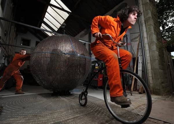 Sculptor Craig Dyson and his apprentice Wilf Henson try to shift his 'Le Grand Scupture' from their Haworth workshop