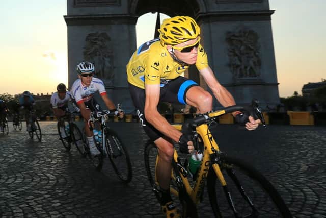 Chris Froome cycles by the Arc dTriomphe during last years final stage (Picture: Getty Images).