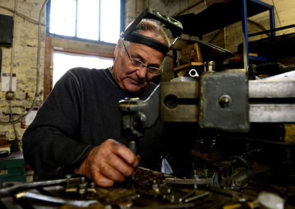 Engraver Mick Shaw at Portland Works in Sheffield