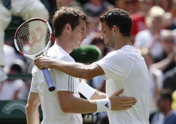 Bulgaria's Grigor Dimitrov is congratulated on his win by Great Britain's Andy Murray (left) during day ten of the Wimbledon Championships