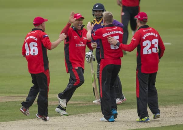 Durham's Gareth Breese is congratulated on catching Yorkshire's Jonny Bairstow.