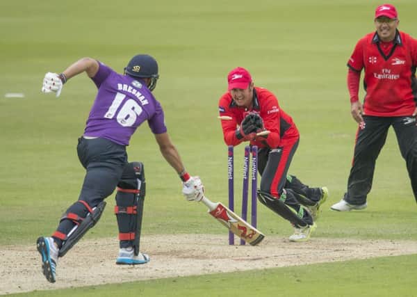 Yorkshire's Tim Bresnan is run out by Durham's Phil Mustard.