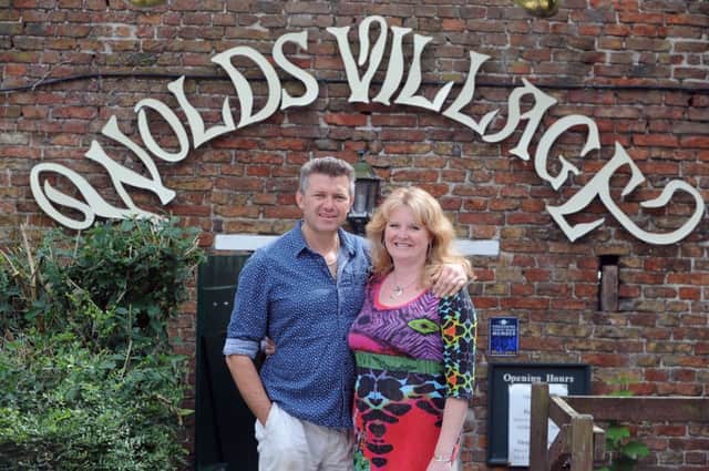 Sally and Chris Brealey at the entrance to Wolds Village.