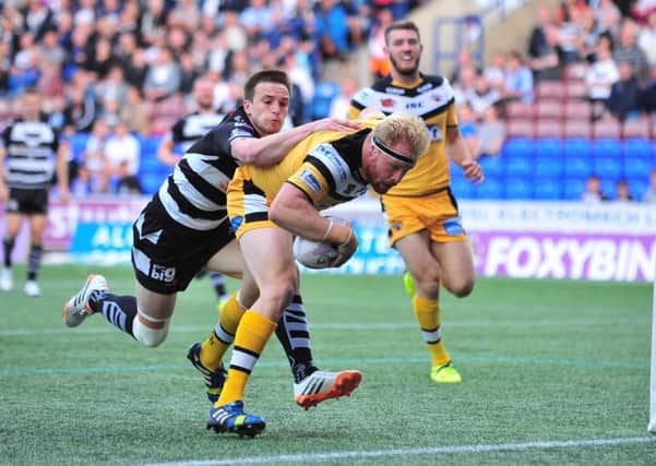Oli Holmes scores a try for Castleford.