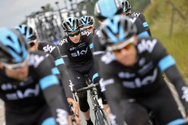 Tour de France title holder Chris Froome is flanked by his Team Sky colleagues during a training session in Leeds yesterday before the start of the 101st edition of the Tour (Picture: AFP Photo/Jeff Pachoud).
