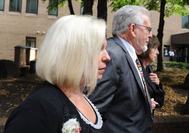 Rolf Harris arrives at Southwark Crown Court, London with daughter Bindi and niece Jenny (right)