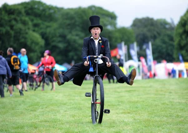 Mr Doo from Solo Circus rides around on site at the Dare 2b Yorkshire Festival of Cycling at Harewood House. Picture by Jonathan Gawthorpe.