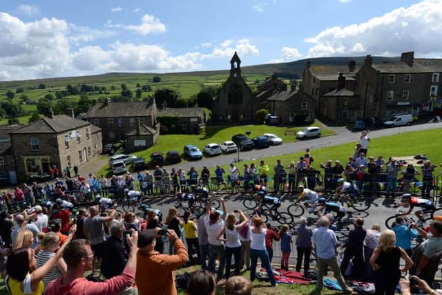 The Peloton passes through the village of Reeth, North Yorkshire