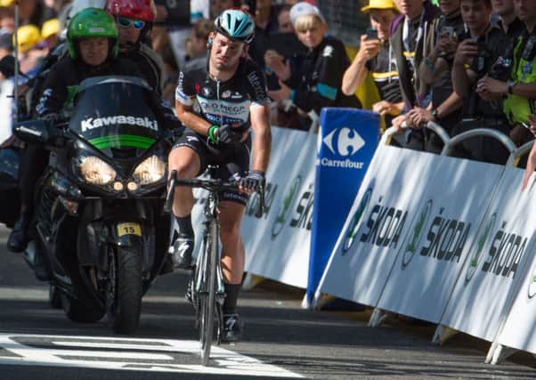 Mark Cavendish rides over the finish line in Harrogate after crashing out of the final sprint of stage one of the Tour de France. Photo: Tim Ireland/PA Wire