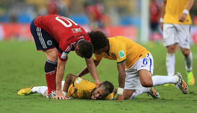 Brazil's Neymar sustains his back injury during the quarter-final against Colombia.