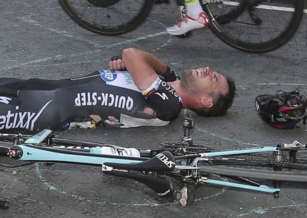 Mark Cavendish grimaces after crashing.