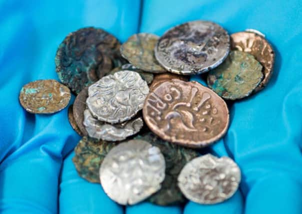 Roman and Late Iron Age coins which were discovered in the Reynard's Cave and Kitchen cavern in Dovedale in the Peak District
