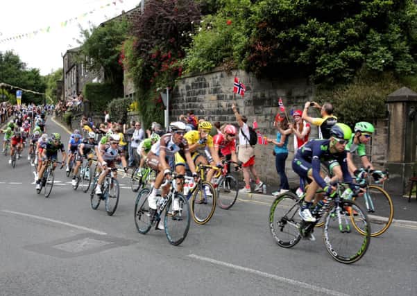 The Tour de France peloton races through Hebden Bridge.